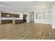 Expansive living room featuring an open floor plan, light wood floors and tray ceilings at 13052 Homestead Ln, Parrish, FL 34219