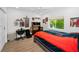 This bedroom is a sports fan's dream, complete with a bed, desk, and sports decor at 15229 Wind Whisper Dr, Odessa, FL 33556