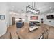 Open-concept living space featuring a kitchen with island and stainless appliances that flows into the living and dining rooms at 15229 Wind Whisper Dr, Odessa, FL 33556