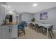 Bright dining area with a modern table, stylish chairs, and a charming starfish wall art piece at 1628 12Th Sw St, Largo, FL 33778