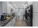 Modern kitchen featuring white cabinets, granite countertops, stainless steel appliances, and recessed lighting at 1628 12Th Sw St, Largo, FL 33778