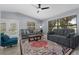 Inviting living room with modern furnishings and a bright ambiance from the natural outdoor lighting at 1628 12Th Sw St, Largo, FL 33778