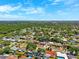 High-angle aerial view captures a tranquil suburban community with verdant landscapes at 1648 Arbor Dr, Clearwater, FL 33756