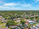 Expansive aerial view of a neighborhood, showcasing lush greenery and community layout at 1648 Arbor Dr, Clearwater, FL 33756