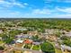Expansive aerial shot showcases the neighborhood with tree-lined streets and vibrant homes at 1648 Arbor Dr, Clearwater, FL 33756