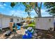 Spacious backyard featuring a patio, hot tub, shed, and playground area at 1648 Arbor Dr, Clearwater, FL 33756