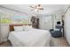 Bright bedroom with natural light, neutral decor, and a comfortable seating area at 1648 Arbor Dr, Clearwater, FL 33756