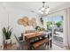 Dining room with wood table, decorative wall art, and sliding glass doors to the patio at 1648 Arbor Dr, Clearwater, FL 33756