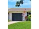 EV charging station is installed next to the garage of this lovely home at 1648 Arbor Dr, Clearwater, FL 33756