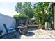 The backyard features a stone fire pit, statues, lush tropical landscaping, and a serene outdoor ambiance at 1704 Via Palermo St, Plant City, FL 33566
