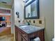 Modern bathroom featuring a stylish vanity, granite countertop, and tiled backsplash at 1704 Via Palermo St, Plant City, FL 33566