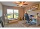 Bright bedroom with view of a pond, desk, and ceiling fan at 1704 Via Palermo St, Plant City, FL 33566