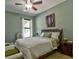 Comfortable bedroom featuring natural light, a ceiling fan and carpeted flooring at 1704 Via Palermo St, Plant City, FL 33566