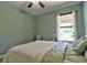 This spacious bedroom features a ceiling fan, natural light and carpeted floors at 1704 Via Palermo St, Plant City, FL 33566