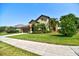 Well-maintained home with lush landscaping and a neatly manicured lawn at 1704 Via Palermo St, Plant City, FL 33566