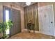Elegant foyer featuring decorative details, tiled floor and natural lighting at 1704 Via Palermo St, Plant City, FL 33566