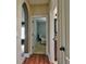 View down hallway showing arched entry and bedroom at 1704 Via Palermo St, Plant City, FL 33566