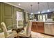 Kitchen with stainless steel appliances, tile flooring, and glass topped table at 1704 Via Palermo St, Plant City, FL 33566