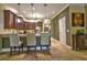 Kitchen features stainless steel appliances, granite countertops, and a breakfast bar at 1704 Via Palermo St, Plant City, FL 33566