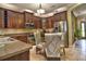 Modern kitchen with stainless steel appliances and granite countertops and dining table at 1704 Via Palermo St, Plant City, FL 33566
