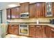 Kitchen featuring stainless steel appliances and custom cabinetry at 1704 Via Palermo St, Plant City, FL 33566