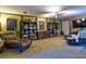 Spacious living room featuring neutral walls, ceiling fan, and ample seating at 1704 Via Palermo St, Plant City, FL 33566