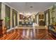 Open-concept living room showcases tile and detailed wood flooring, with elegant archways to other rooms at 1704 Via Palermo St, Plant City, FL 33566
