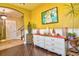 View of the white dresser and artwork on the wall of the living room at 1704 Via Palermo St, Plant City, FL 33566