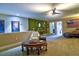 Living room featuring a coffee table with a chess set, sofa, and a leather chaise at 1704 Via Palermo St, Plant City, FL 33566