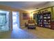 Spacious living room with a view to another room and featuring neutral walls and carpeting at 1704 Via Palermo St, Plant City, FL 33566