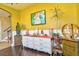 View of the dresser and artwork on the wall in the yellow living room at 1704 Via Palermo St, Plant City, FL 33566