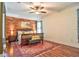 Beautiful main bedroom with striking wood accent wall, decorative rug and a ceiling fan at 1704 Via Palermo St, Plant City, FL 33566