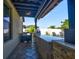 This covered outdoor kitchen has a granite counter, tiled floor, and stainless grill, perfect for entertaining guests at 1704 Via Palermo St, Plant City, FL 33566