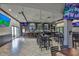 An interior view of the bar and restaurant with multiple TVs and ample seating at 1802 Bedford Ter # 187, Sun City Center, FL 33573