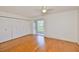 Spacious bedroom featuring hardwood floors, closet space and natural light at 1802 Bedford Ter # 187, Sun City Center, FL 33573