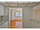 Dining room featuring hardwood floors and a view into the kitchen area at 1802 Bedford Ter # 187, Sun City Center, FL 33573