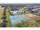 Aerial view of the community pool, playground, tennis court, and basketball court at 18796 Obregan Dr, Spring Hill, FL 34610