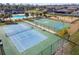 Community amenities featuring a pool, playground, basketball court, and tennis court at 18796 Obregan Dr, Spring Hill, FL 34610