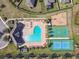 Aerial view of the community pool, playground, basketball court, and tennis court at 18796 Obregan Dr, Spring Hill, FL 34610