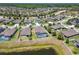 An aerial view showcases the property's pool with screened enclosure in a desirable neighborhood at 18796 Obregan Dr, Spring Hill, FL 34610