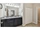 Bathroom showcasing double sinks with granite countertops and ample cabinet space at 18796 Obregan Dr, Spring Hill, FL 34610