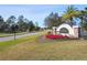 Welcoming Talavara community entrance with manicured landscaping and a stone monument sign among mature trees at 18796 Obregan Dr, Spring Hill, FL 34610