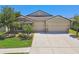 Charming single-Gathering home with a stone facade, manicured landscaping, and a three-car garage at 18796 Obregan Dr, Spring Hill, FL 34610
