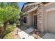 Charming home exterior with stone accents, lush landscaping, and a covered entryway at 18796 Obregan Dr, Spring Hill, FL 34610