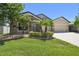 Charming single-story home with stone accents, manicured lawn, and mature landscaping at 18796 Obregan Dr, Spring Hill, FL 34610