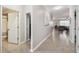 Bright hallway featuring tile floors that lead to the open living area at 18796 Obregan Dr, Spring Hill, FL 34610
