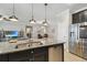 Open concept kitchen with a granite island with stainless steel dishwasher at 18796 Obregan Dr, Spring Hill, FL 34610