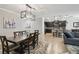 Bright living room and kitchen with modern lighting and neutral decor at 18796 Obregan Dr, Spring Hill, FL 34610