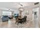 Open-concept living and dining room featuring tile flooring, neutral colors, and recessed lighting at 18796 Obregan Dr, Spring Hill, FL 34610