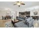 Open layout showcasing the living, dining, and kitchen areas with a modern aesthetic and neutral tones at 18796 Obregan Dr, Spring Hill, FL 34610